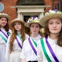 Four suffragettes outside the Centre 